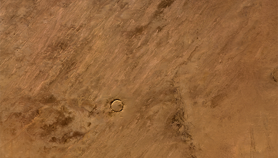 A circular crater in the Sahara Desert