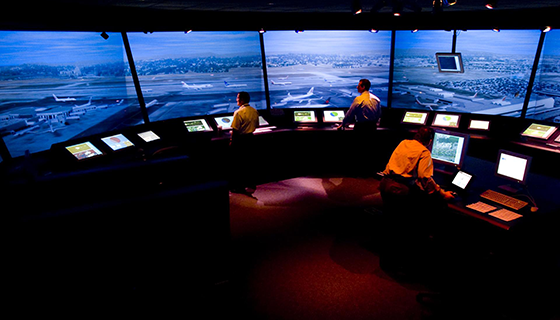 NASA researchers work inside a simulated air traffic control tower