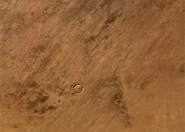 A circular crater in the Sahara Desert