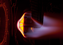 A flexible heat shield glows orange and white as it reaches extremely hot temperatures