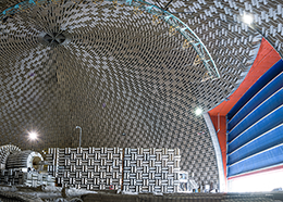 A large dome with walls filled with fiberglass wedges to absorb sound