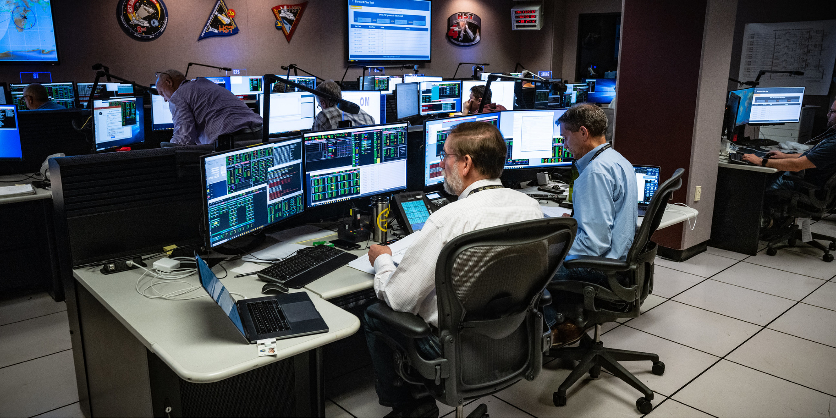 Employees working in the Twin Control Rooms at NASA Marshall Support Science, Mission Safety for Artemis - NASA Force Header