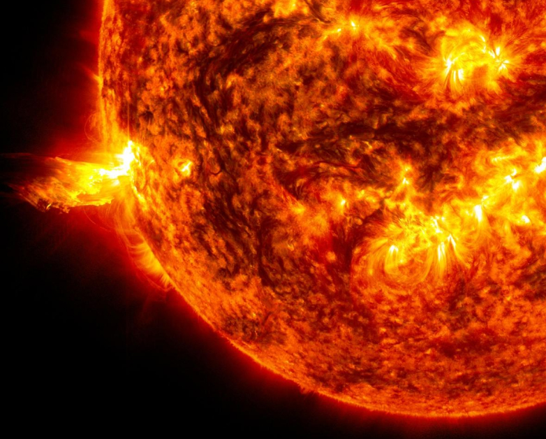 Image of the Sun with a solar flare escaping from the side.