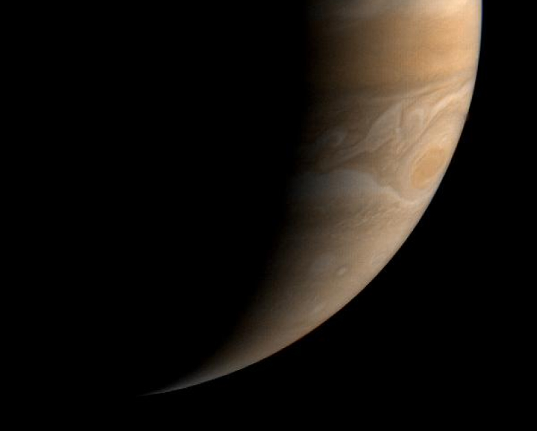 Artist illustration of Jupiter partially shaded. 