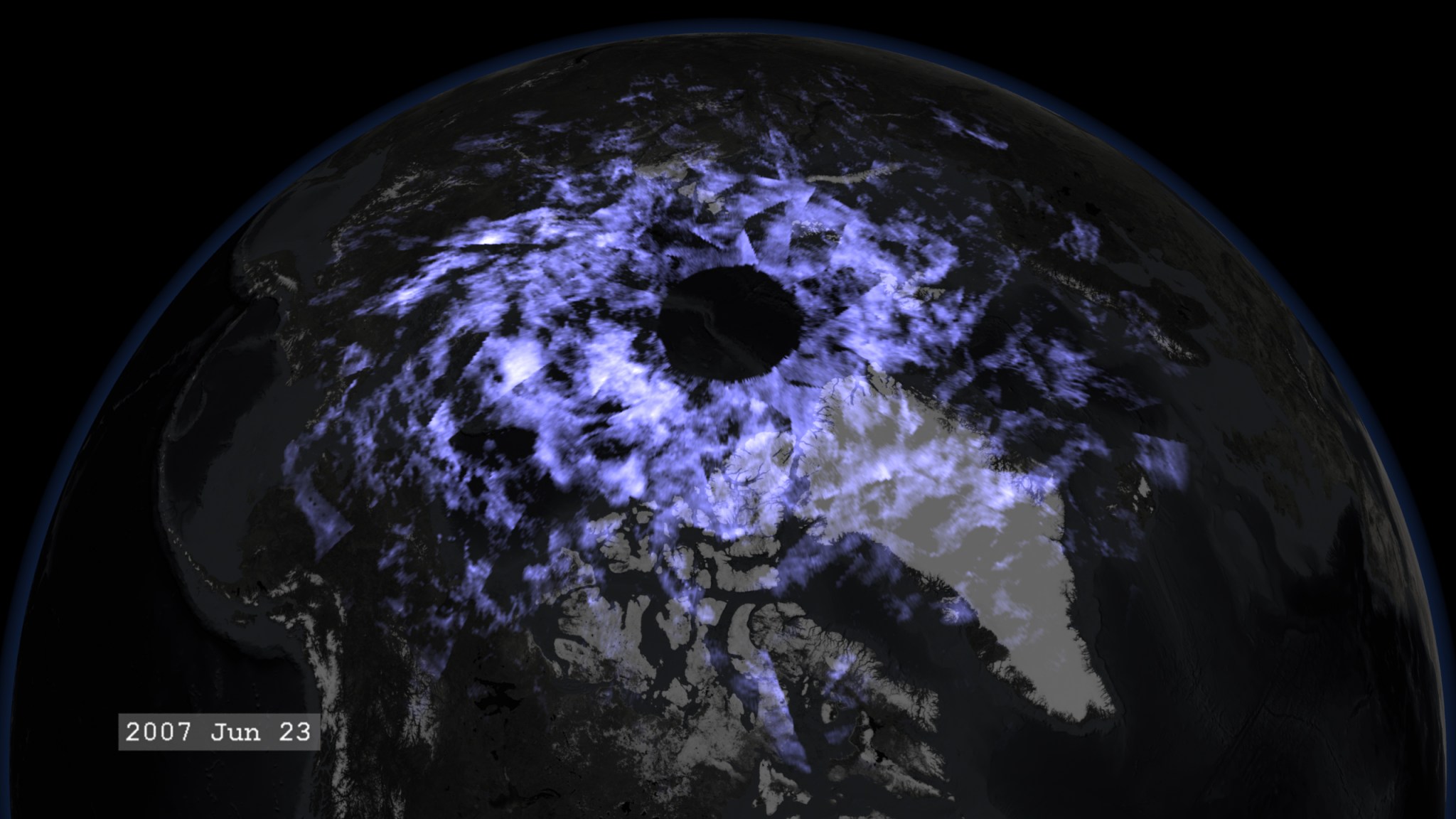 The Earth seen from Above, covered in shining blue clouds. It's dated 2007 Jun 23.
