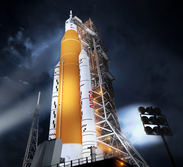 An illustrated view of the Block 1B crew configuration of NASA’s powerful Space Launch System (SLS) rocket the night before launch