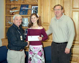 Kerisha Schultz (center), Dryden Director Kevin Petersen (left) and Craig Schultz (right)