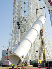 A 39,000-gallon water tank is lifted into place at the A-3 Test Stand construction site at Stennis Space Center.