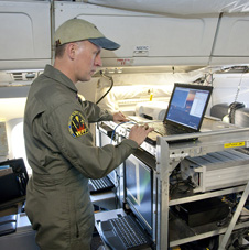 URS Corp. scientist checks out the Airborne Topographic Mapper mounted in NASA's DC-8.