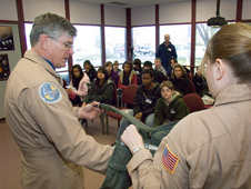 NASA Dryden research pilot Jim Smolka and operations engineer Leslie Molzahn demonstrate the partial pressure suits.
