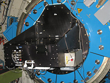 The High-Speed Imaging Photometer for Occultations, or HIPO, instrument is attached to the interior portion of the infrared telescope.