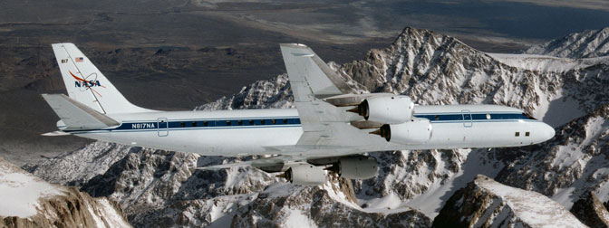 NASAs DC-8 airborne science laboratory soars over the Pinnacles near Mt. Whitney, Calif., during a checkout flight in the winter of 1998.