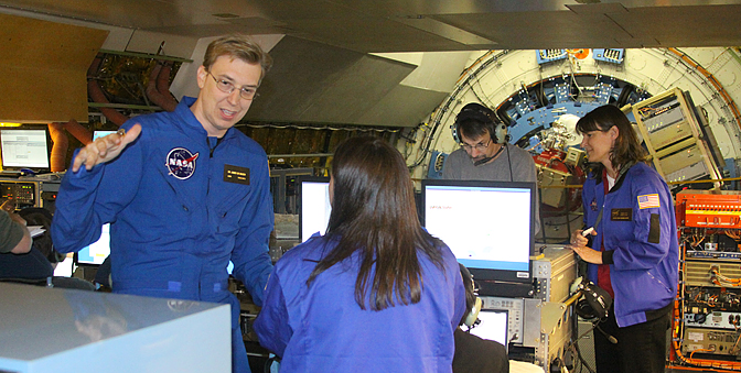 SOFIA staff scientist James De Buizer (left) discusses an infrared image.