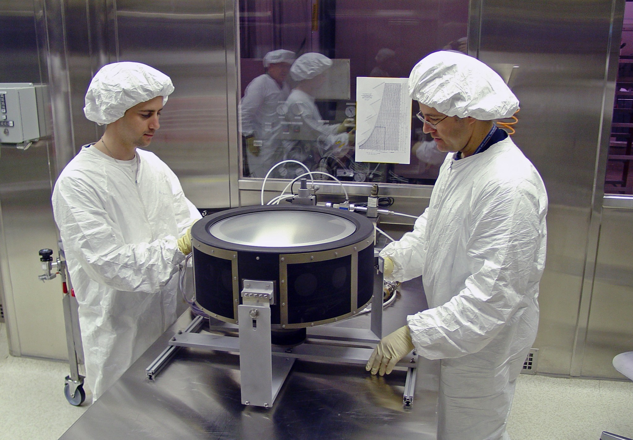 Technicians check out a prototype NEXT thruster