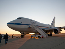 Ground crewmen approach NASA's SOFIA flying observatory shortly after the modified Boeing 747SP carrying a 100-inch telescope landed following an all-night astronomical observation mission.