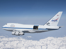 With the sliding door over its 17-ton infrared telescope wide open, NASA's Stratospheric Observatory for Infrared Astronomy – or SOFIA – soars over California's snow-covered Southern Sierras on a test flight in 2010