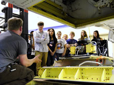 James Jacobson of NASA Ames Research Center and the University of California at Santa Cruz describes the MASTER remote sensing instrument to SARP student participants as it is installed in NASA's P-3B.