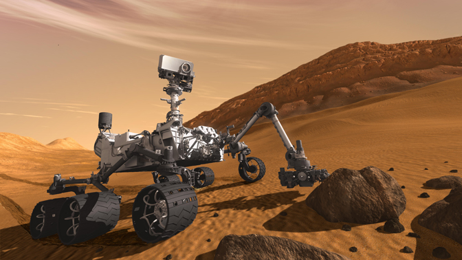 In this artist's concept, NASA's Mars Science Laboratory Curiosity rover examines a rock on Mars with a set of tools at the end of the rover's arm, which extends about seven feet. The rover is designed to investigate Mars' past or present ability to sustain microbial life.