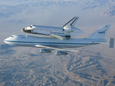 The Space Shuttle Endeavour mounted atop a modified Boeing 747 carrier aircraft flies over California's Mojave Desert on the first leg of its ferry flight back to the Kennedy Space Center on Dec. 10, 2008 after landing at Edwards Air Force Base to conclude shuttle mission STS-126. Endeavour will be