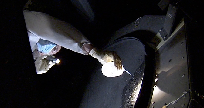 Technician cleaning SOFIA's mirror
