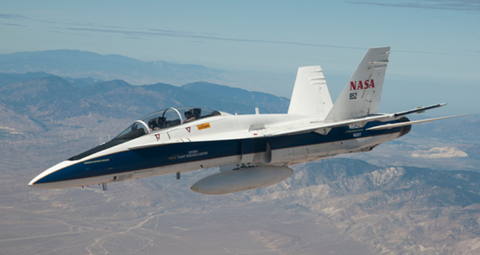 NASA's F/A-18B mission support aircraft 852 is pictured flying over the high desert near the Tehachapi Mountains northwest of Mojave, Calif.
