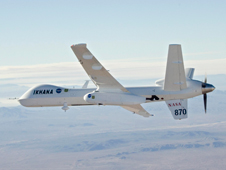 NASA's MQ-9 Predator B unmanned aircraft, the Ikhana, is shown during a Southern California wildfire imaging mission in October 2007 with the Autonomous Module Scanner pod slung under its left wing.