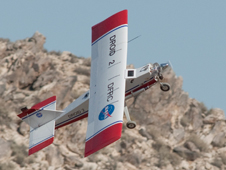 NASA Dryden's DROID research aircraft executes a hard right climbing turn to avoid crashing into a rocky desert ridge during flight tests of a ground collision avoidance system for small unmanned air vehicles.