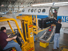 Technicians at NASA's Langley Research Center in Hampton, Va., prepare a B200 aircraft for the DISCOVER-AQ air pollution measurement mission in California.