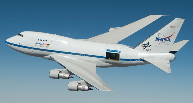 NASA's Stratospheric Observatory for Infrared Astronomy (SOFIA) is shown with its telescope door partly open during a test flight for its astronomical observation mission.