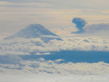 An ash cloud from an eruption of the Tungurahua volcano in Ecuador and the peak of the dormant Chimborazo volcano project through cloud cover in this photo taken from NASA's C-20A flying at 41,000 feet altitude about 100 miles northeast of Guayaquil, Ecuador on March 17.