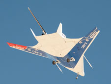 The manta ray-like shape of the X-48C Hybrid Wing Body aircraft is obvious in this underside view as it flies over Edwards Air Force Base on a test flight on Feb. 28, 2013.