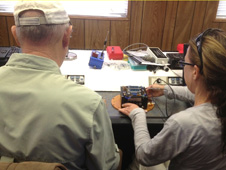 Dougal Maclise, technology manager for the Flight Opportunities Program at NASA's Ames Research Center, and researcher Karolyn Ronzano prepare the Suborbital Flight Environment Monitor (SFEM) payload for flight on UP Aerospace's SL7 sounding rocket.