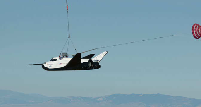 Sierra Nevada Corporation's Dream Chaser engineering test spacecraft is hoisted into the air during a captive carry test Aug.22 at NASA Dryden. (NASA / Ken Ulbrich)