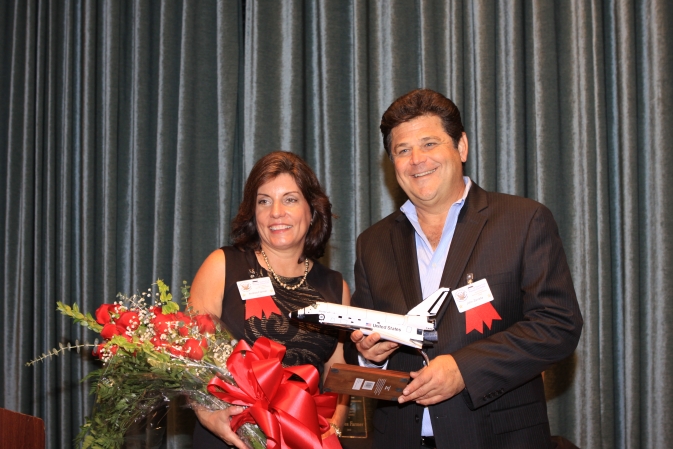 Andrea Farmer, senior public relations manager with Delaware North Companies Parks & Resorts, and John Zarrella, CNN Miami correspondent, received 2013 Harry Kolcum Memorial News and Communications Awards from the National Space Club Florida Committee Nov. 12.