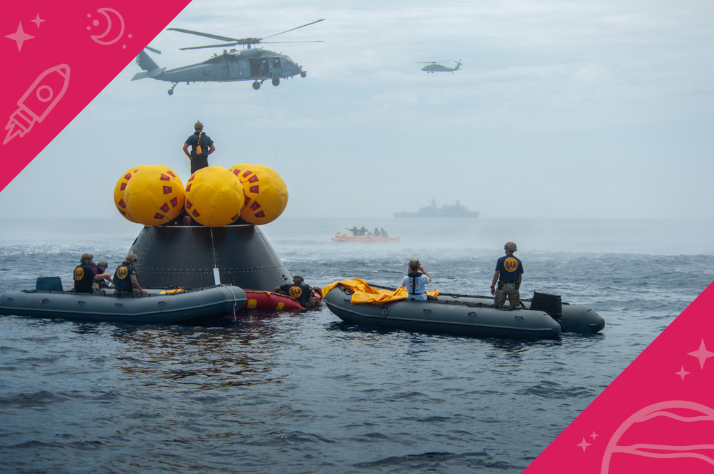 Naval helicopters fly over a test version of NASA’s Orion spacecraft and personnel involved in training activities in the Pacific Ocean