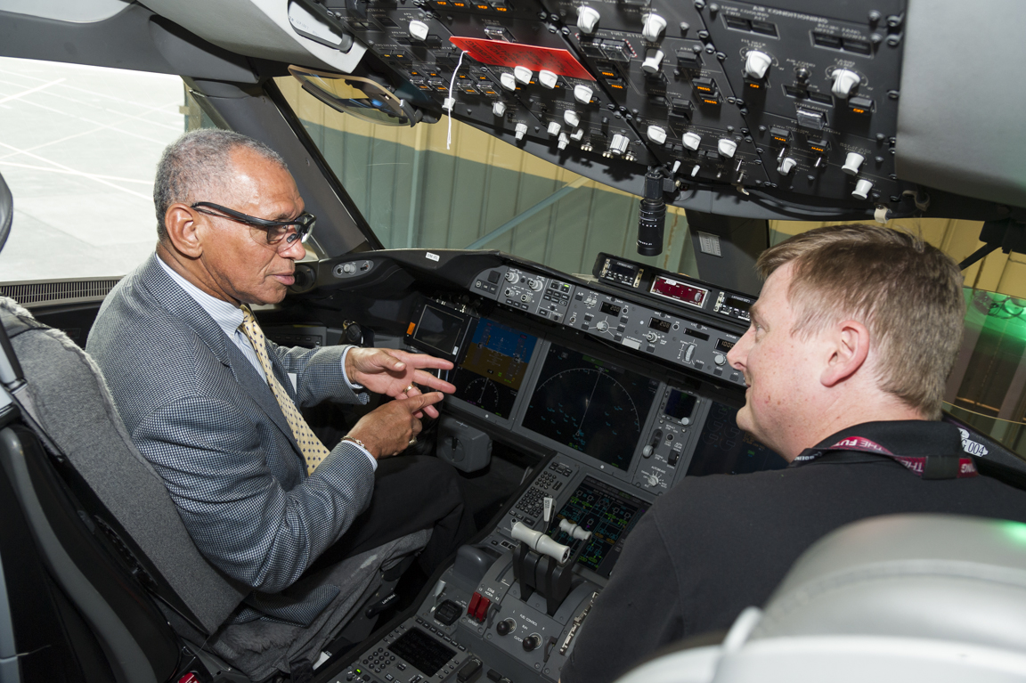 Charlie Bolden and Boeing test pilot sitting inside the cockpit of the ecoDemonstrator.