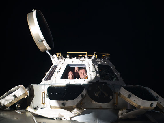 Station Trio Peers out from Cupola