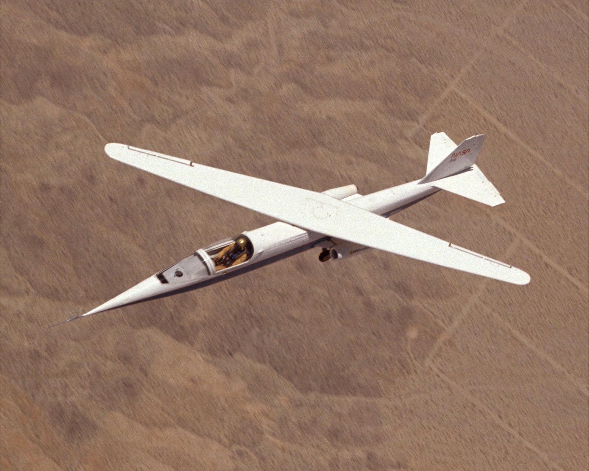 An oblique wing aircraft in flight.