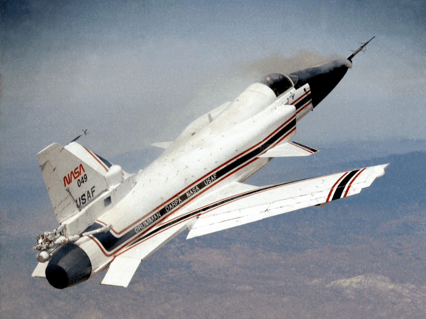 The smoke coming from the nose of the X-29 is demonstrating forebody vortex flow at a high angle of attack.