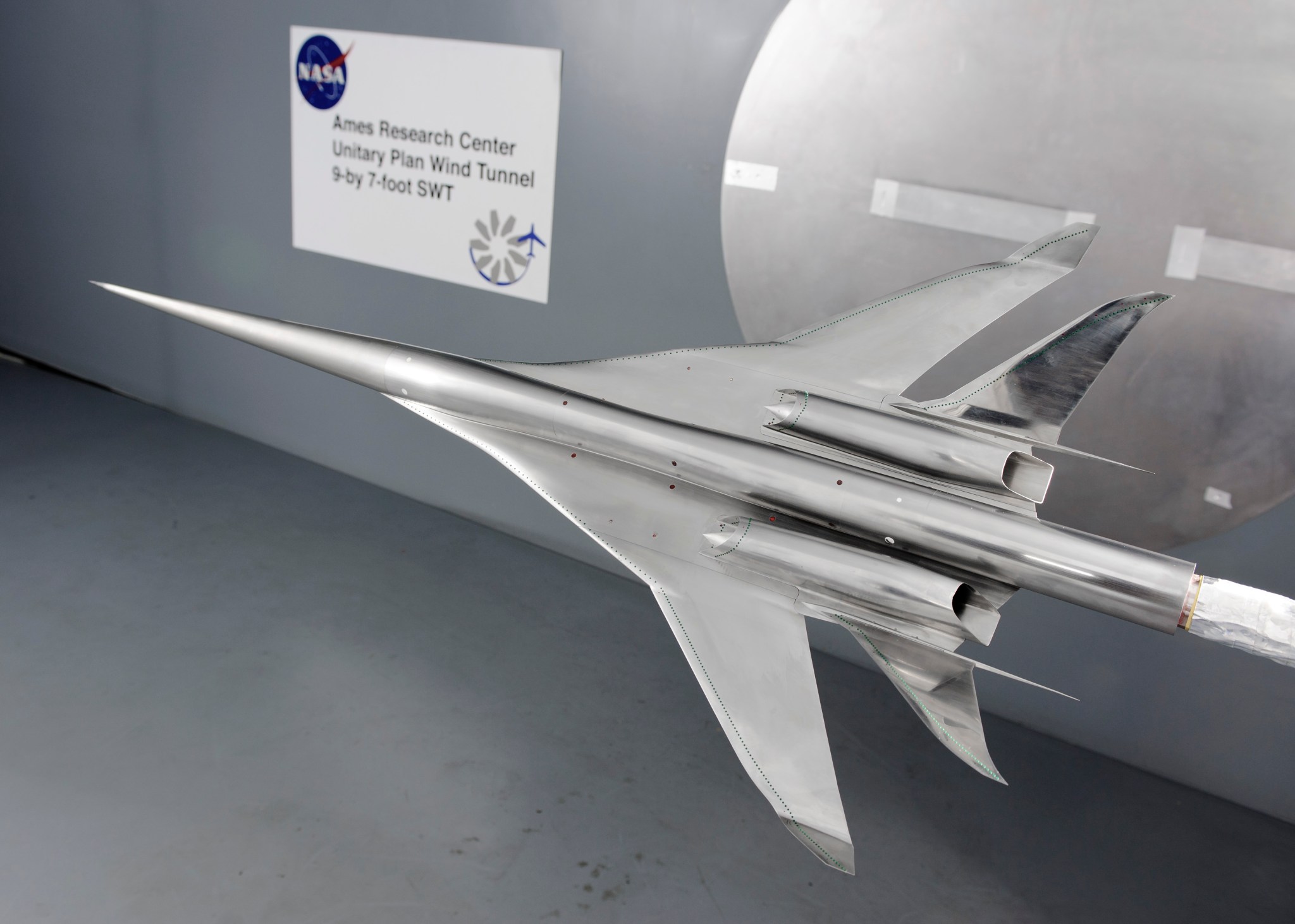 Scale model of airplane in wind tunnel.