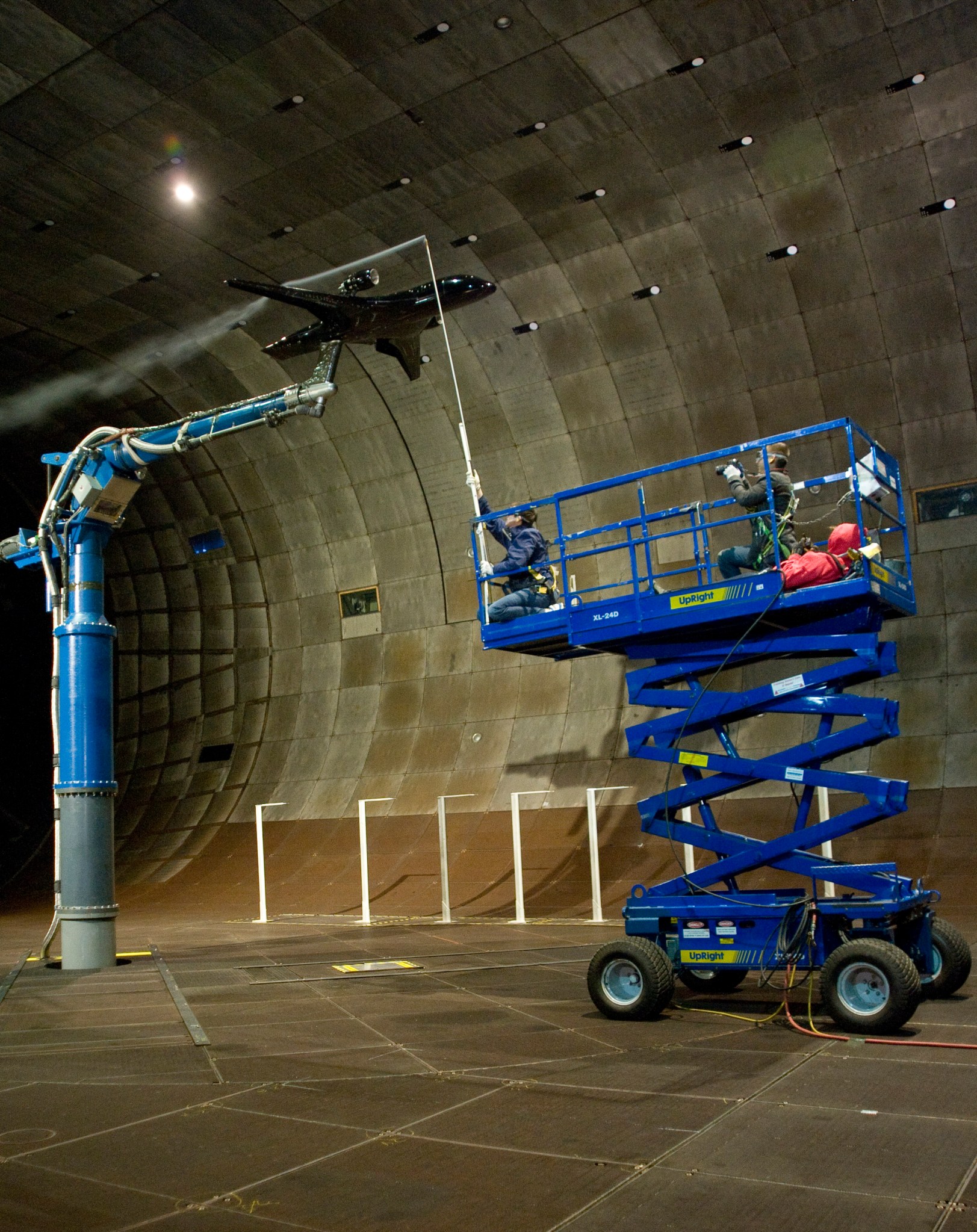 Image of Cal Poly research students controlling the smoke visualization wand.