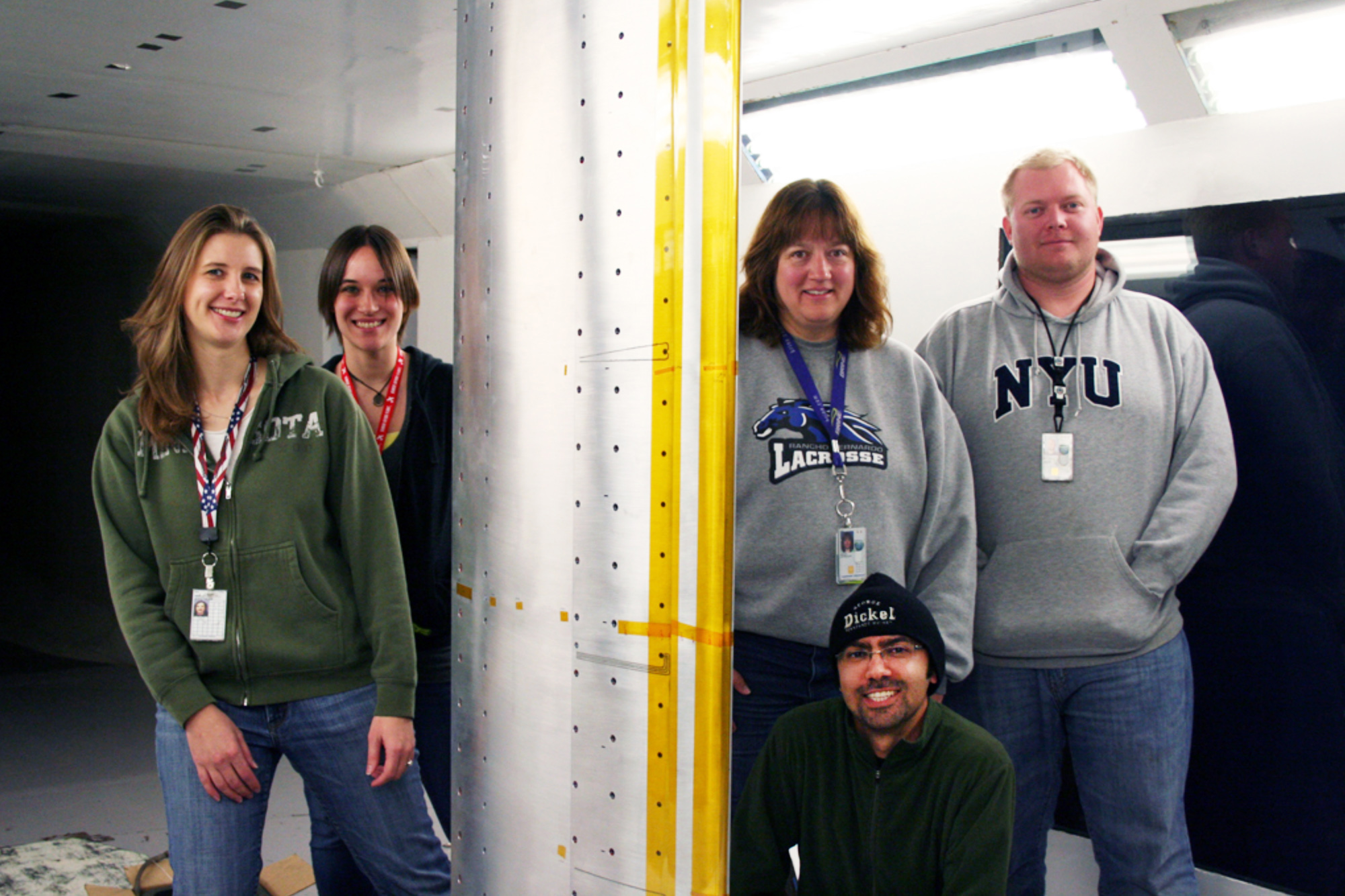 The Northrop Grumman design, fabrication and research team in front of the AHLLE model.