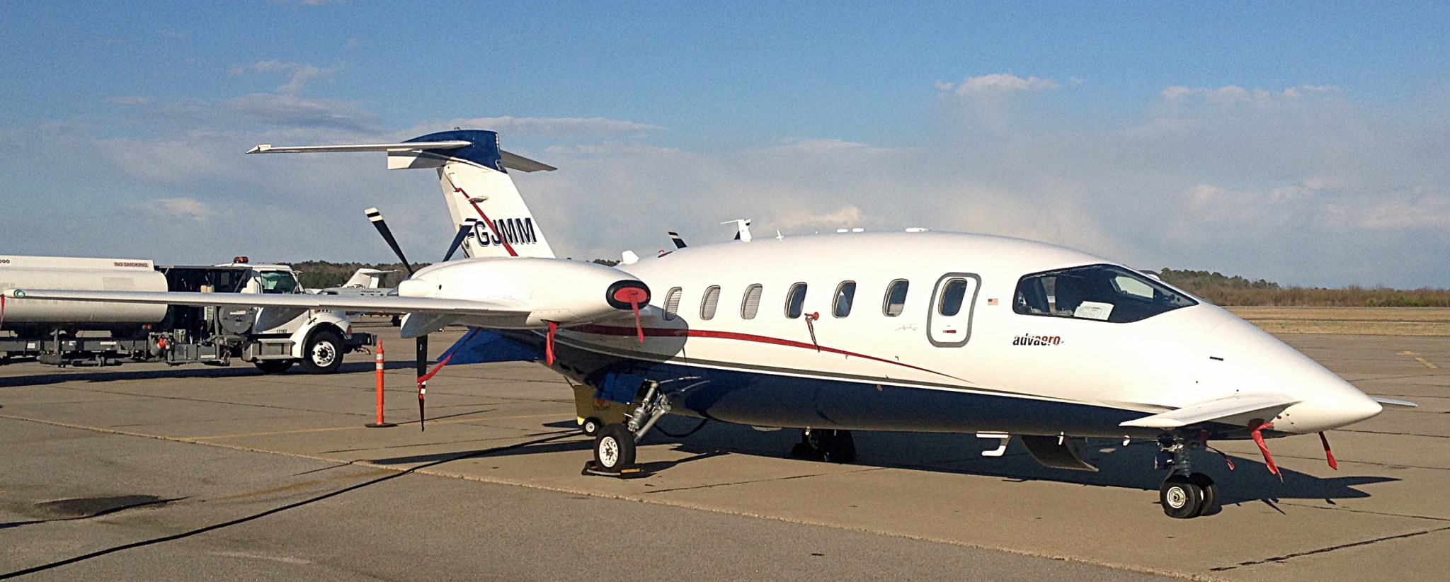 Piaggio P.180 Avanti aircraft parked on the tarmac.