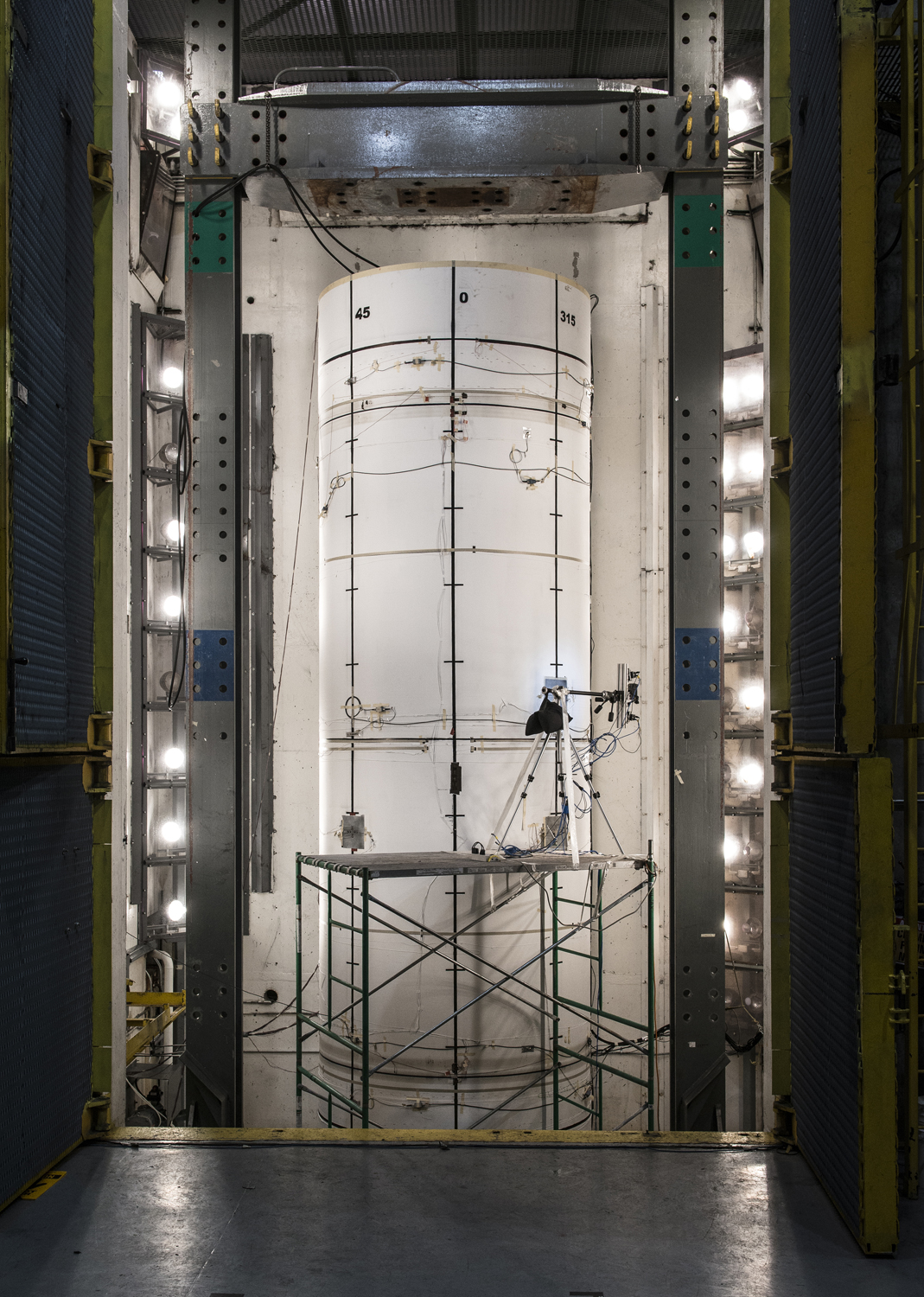 Standing more than two stories tall, the composite test structure was pressurized with water until it burst.