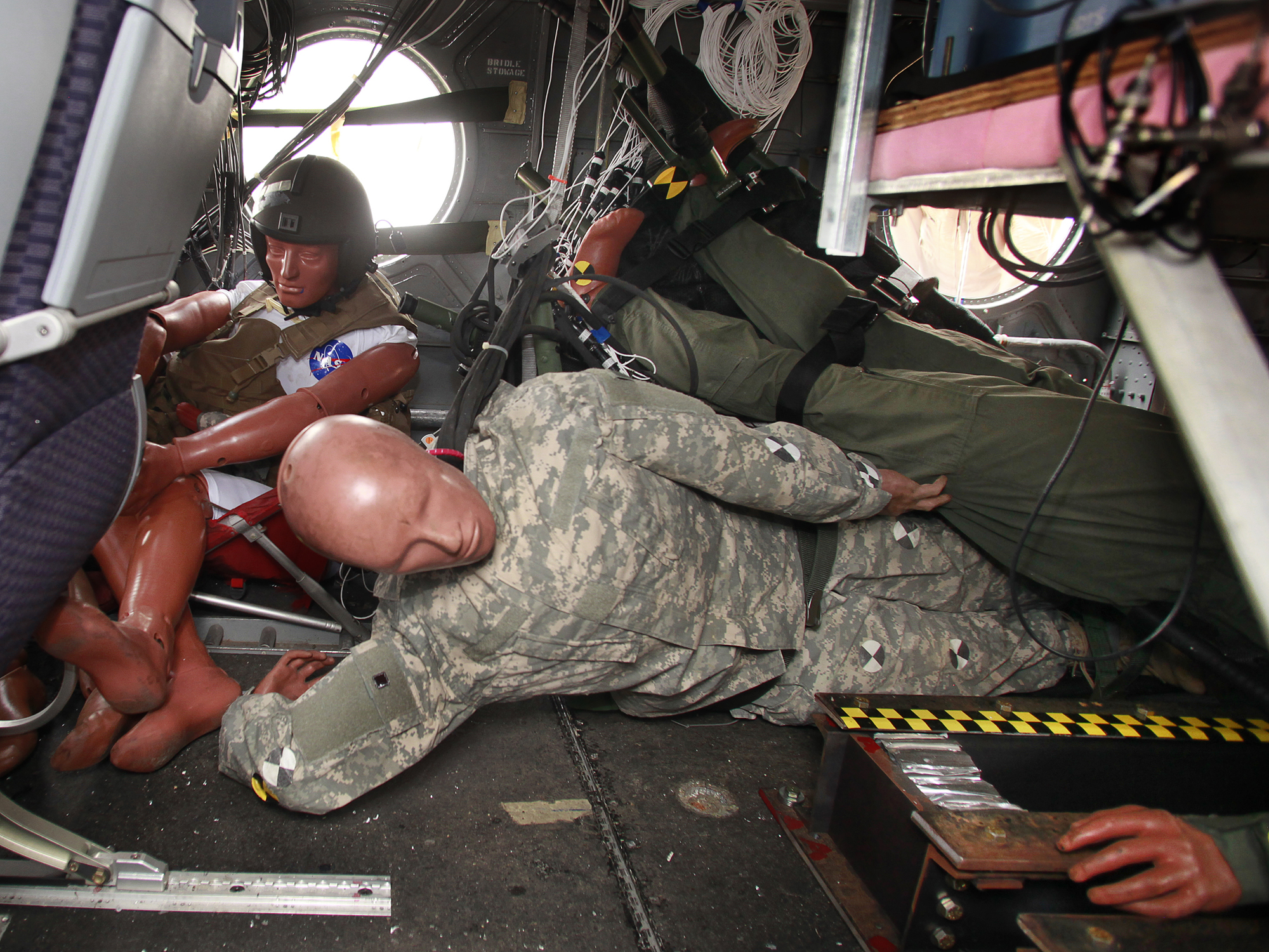 Crash dummies in a helicopter fuselage after a drop test.