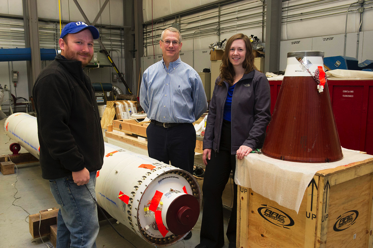 Lisa Tunstill inspects Peregrine solid rocket motor