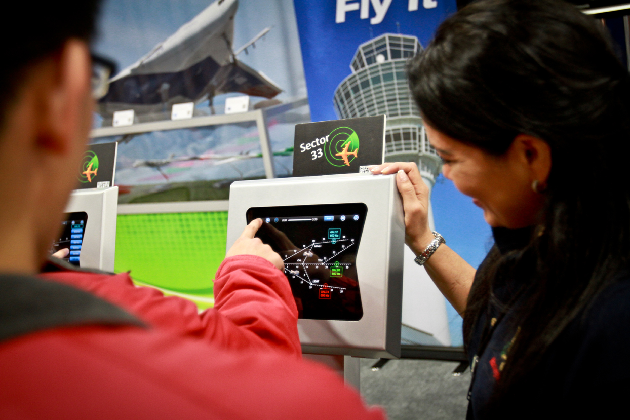 A young man is working on the Sector 33 App at the Science and Engineering festival.