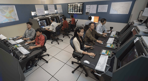 A group of NASA researchers and controllers running a simulation.