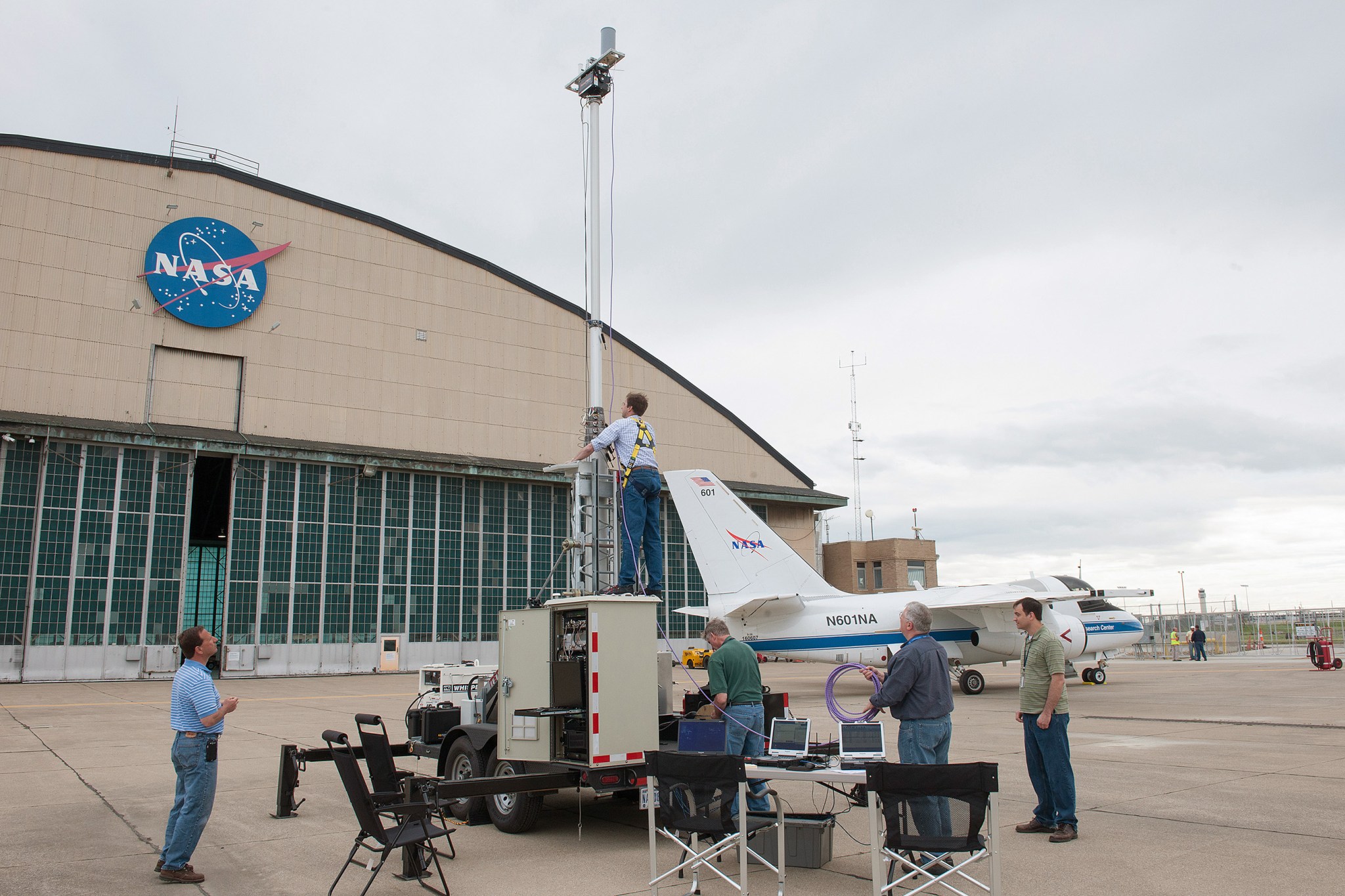 NASA engineer standing on the trailer.