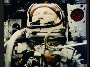 Close-up photo of astronaut John Glenn inside the Friendship 7 spacecraft during his orbital flight on February 20, 1962